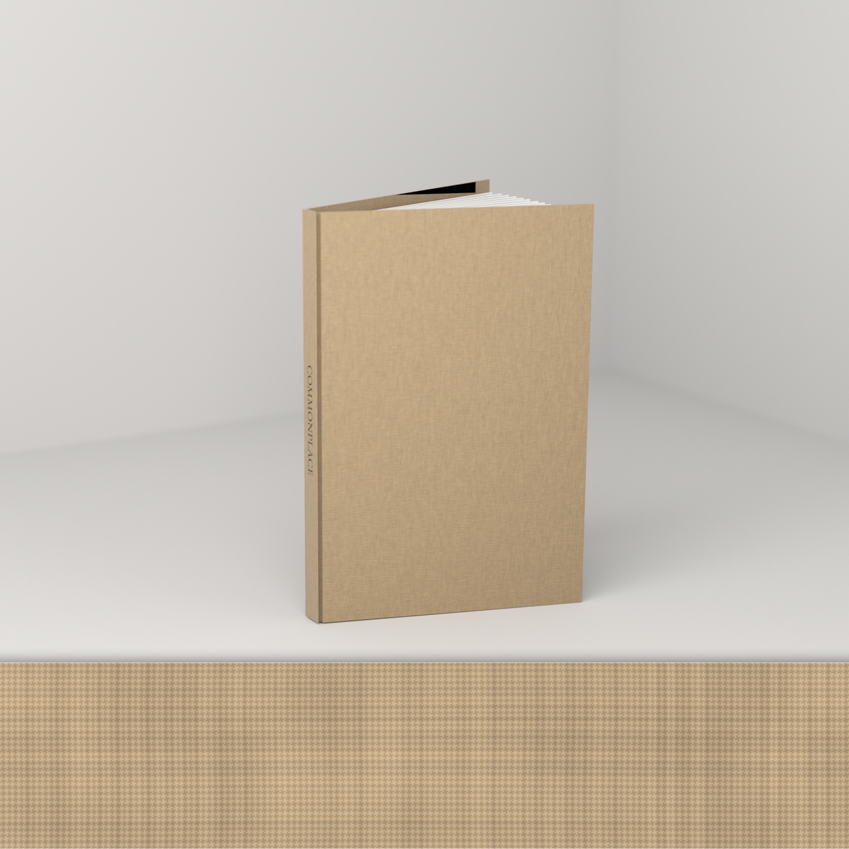 Tan linen edition [linen] — open, showing the cloth case and blank ruled pages
