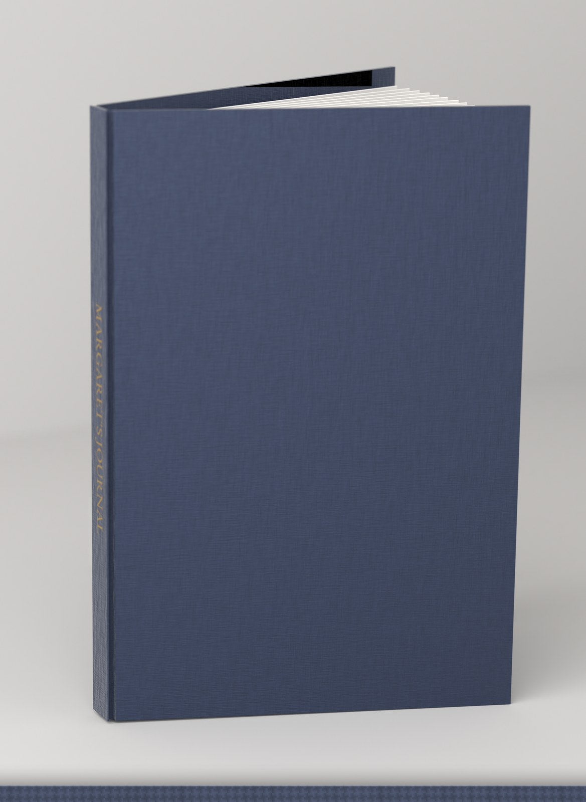 Navy linen journal with 'Margaret's Journal' foil-stamped in gold down the spine
